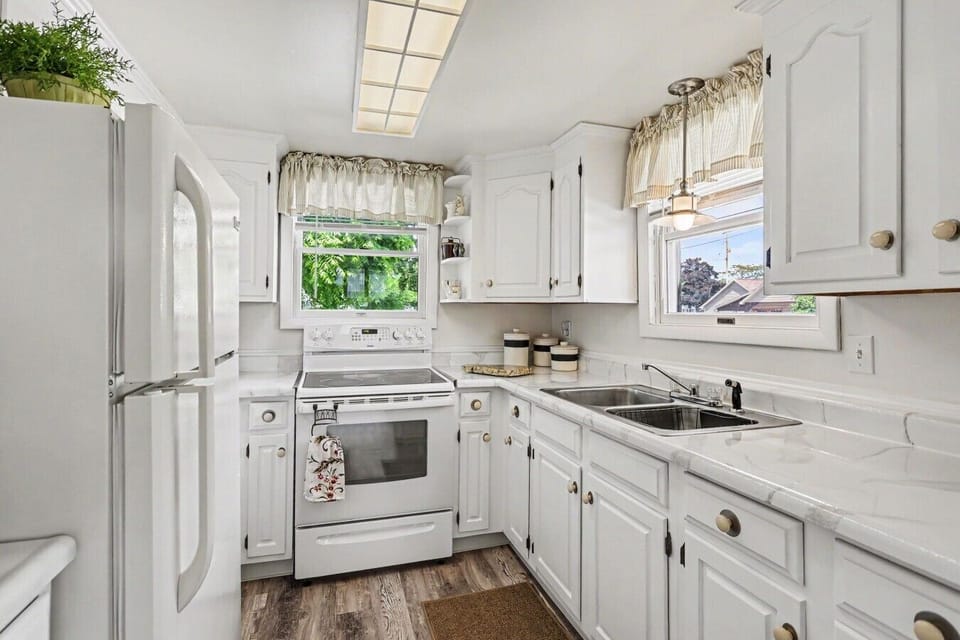 Kitchen | White Electric Range | Double Sink & Natural Light