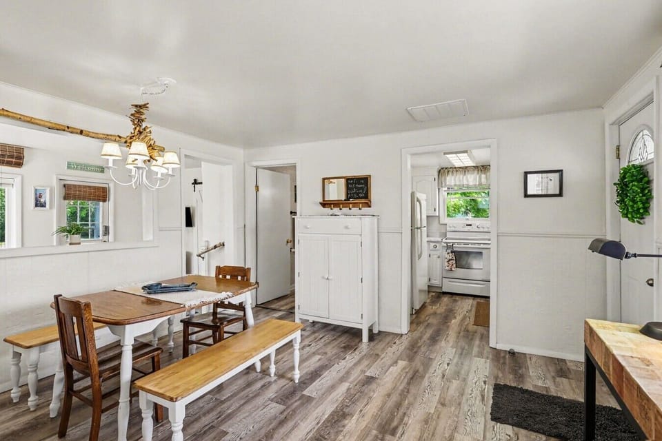 Dining Area | Farmhouse Table & Bench | Driftwood Chandelier & Kitchen Access