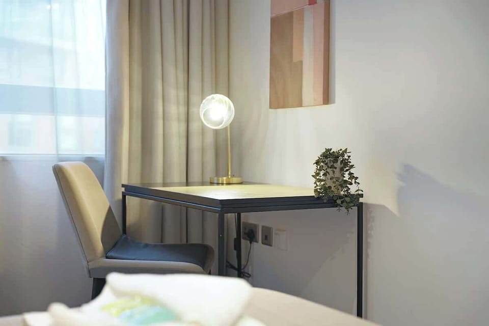 Bedroom 1 offers flexibility and comfort with a cozy double bed, and a TV, creating a restful retreat perfect for unwinding and enjoying a peaceful night’s sleep.