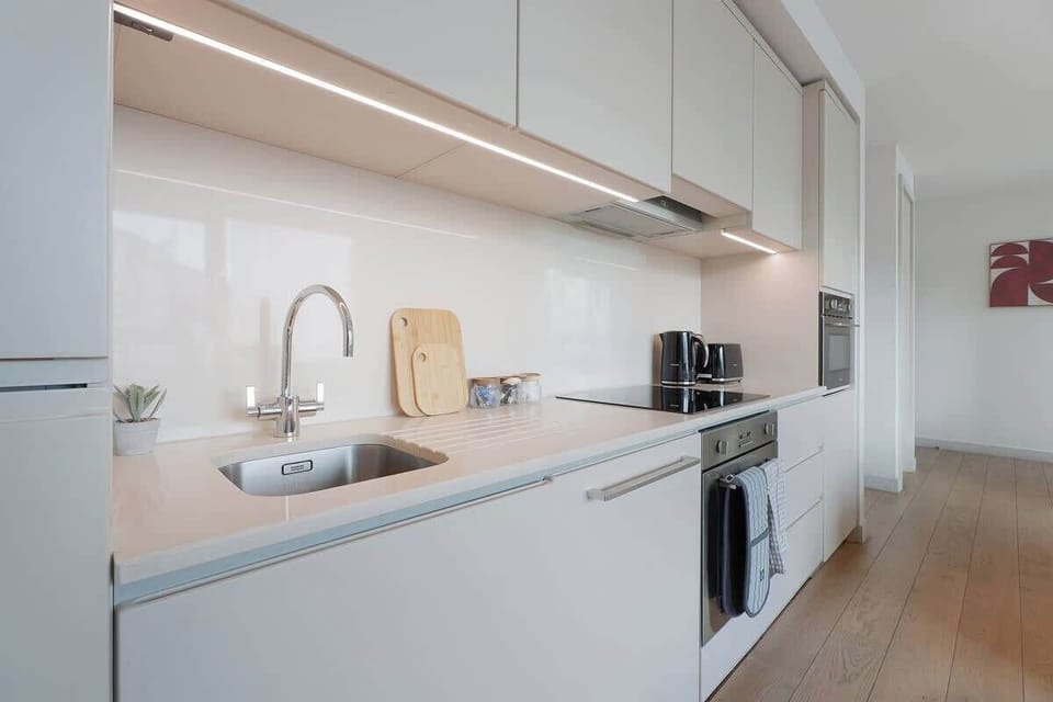 Kitchen equipped with all essentials, including, oven, fridge and full cookware set.