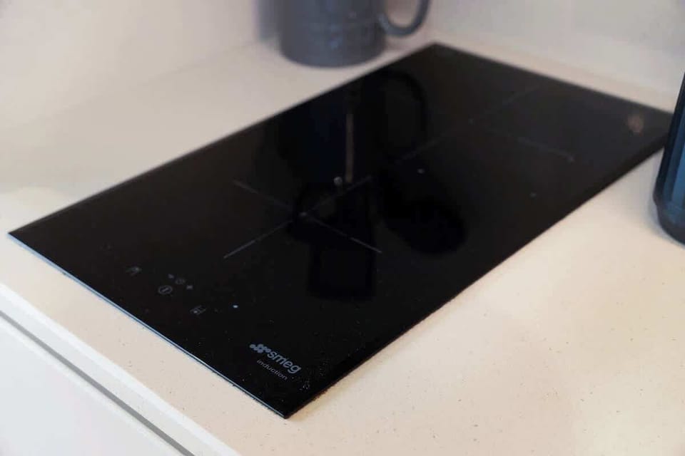 Kitchen equipped with all essentials, including, oven, fridge and full cookware set.
