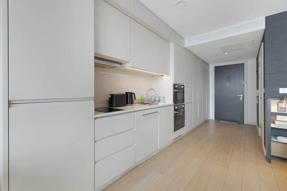 Kitchen equipped with all essentials, including, oven, fridge and full cookware set.