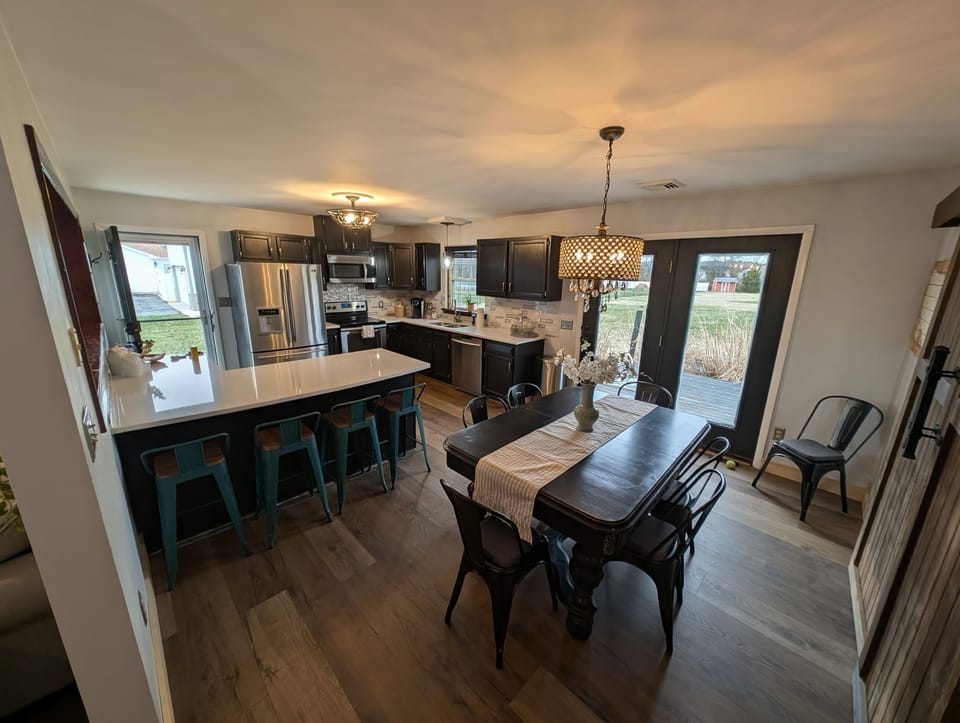 Open Kitchen, Dining and Living Rooms looking into HUGE backyard!