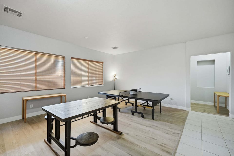 game room with ping pong table and games