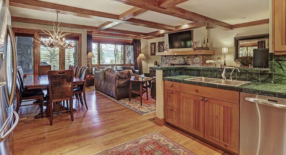 Enjoy the spacious open-concept living and dining area, equipped with a large dining table, comfortable seating, and a seamless connection to the kitchen.