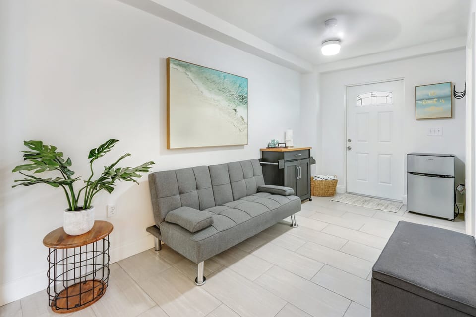 Guest Bedroom-First Floor 
Ensuite | Offers a sitting area with couch, mini fridge and bar cart.