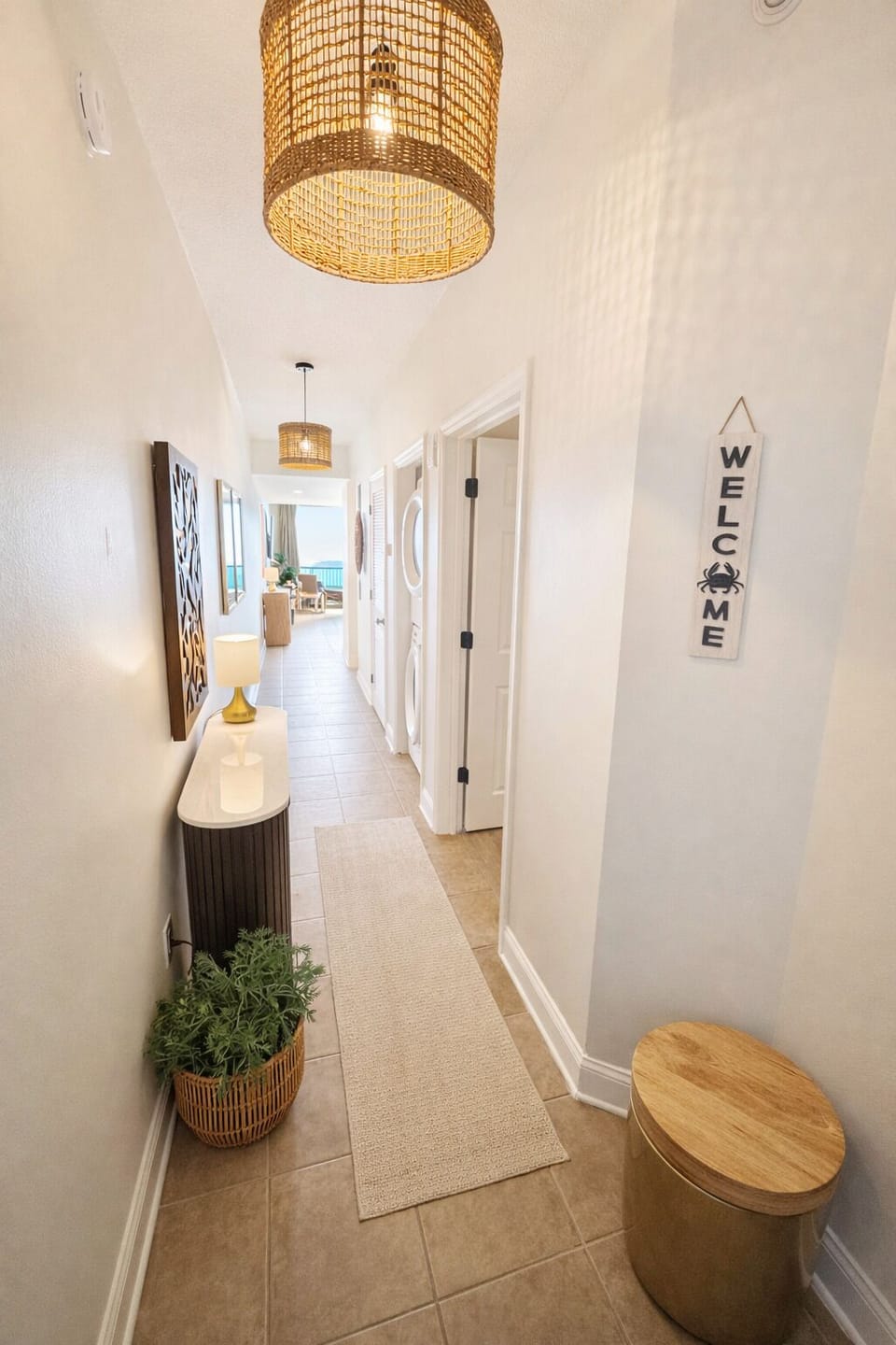 Entryway to the unit with warm and inviting decor