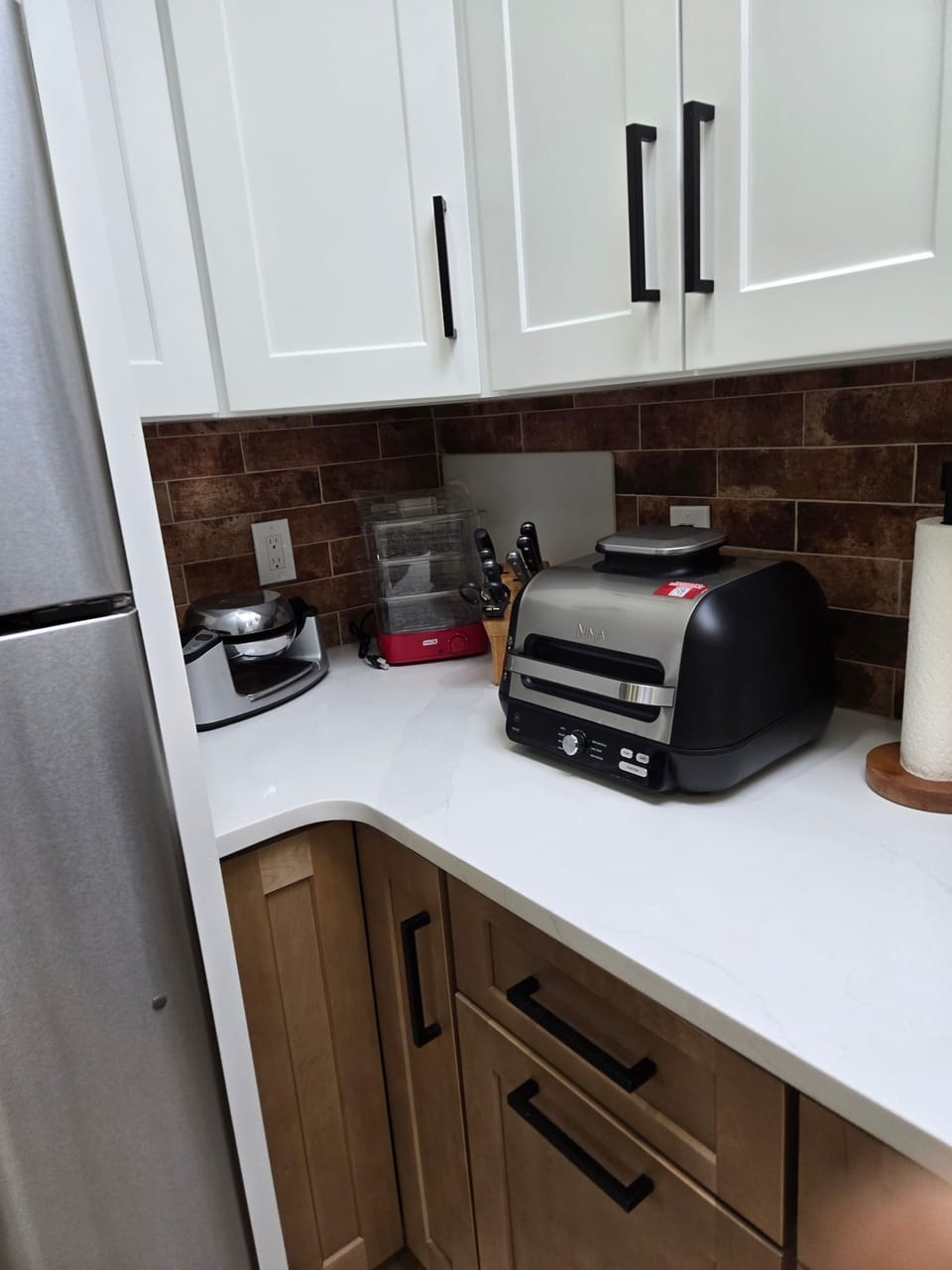 Kitchen - Waffle maker, Ninja multi-purpose appliance, and steamer.