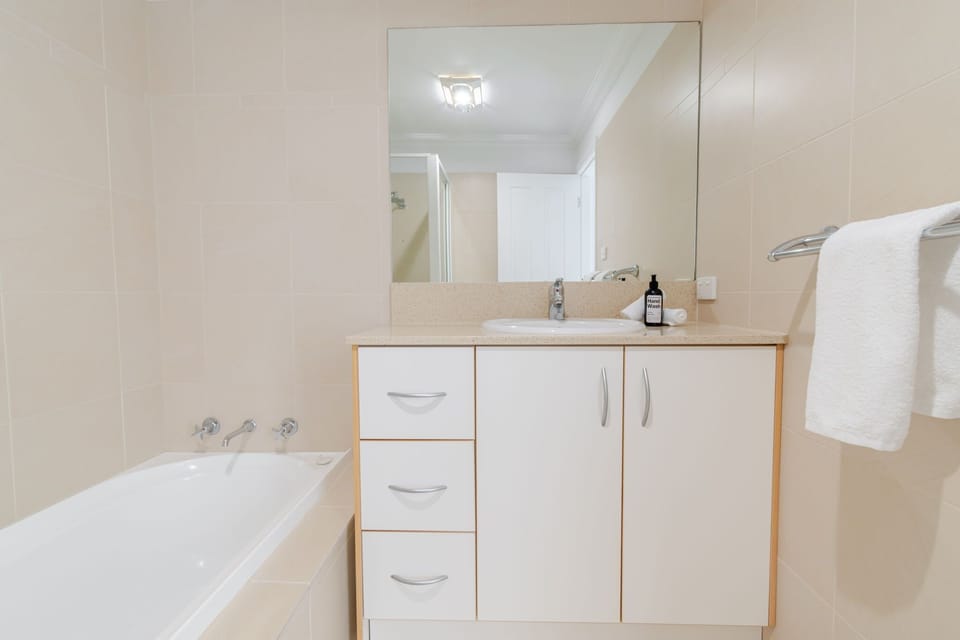 Bathroom - Shower, Bathtub, Toilet + Hair Dryer