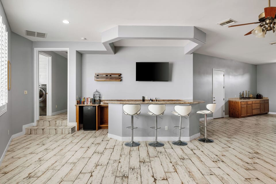 Bonus Living Space with TV, Sofas, and Bar