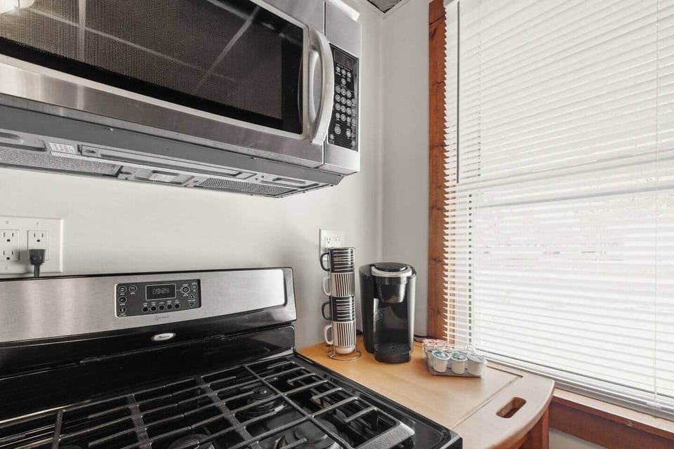 A keurig coffee maker is supplied with coffee pods and all cooking basics. 