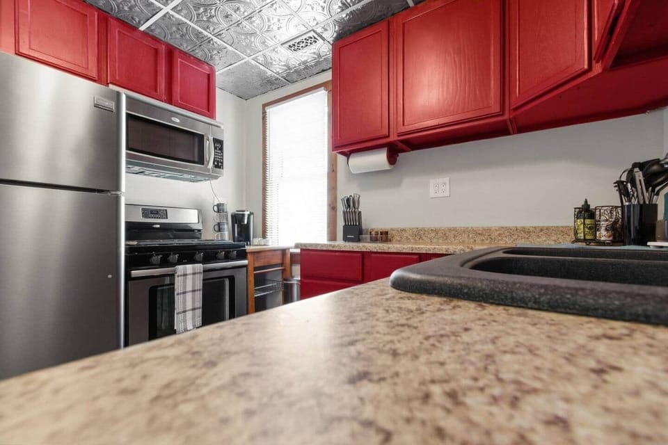 The renovated kitchen maintains the warm and vibrancy of the original farmhouse kitchen with many modern updates.  