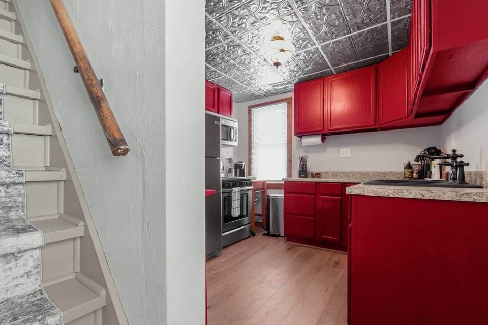 The stairs to the upstairs are near the spacious chef's kitchen