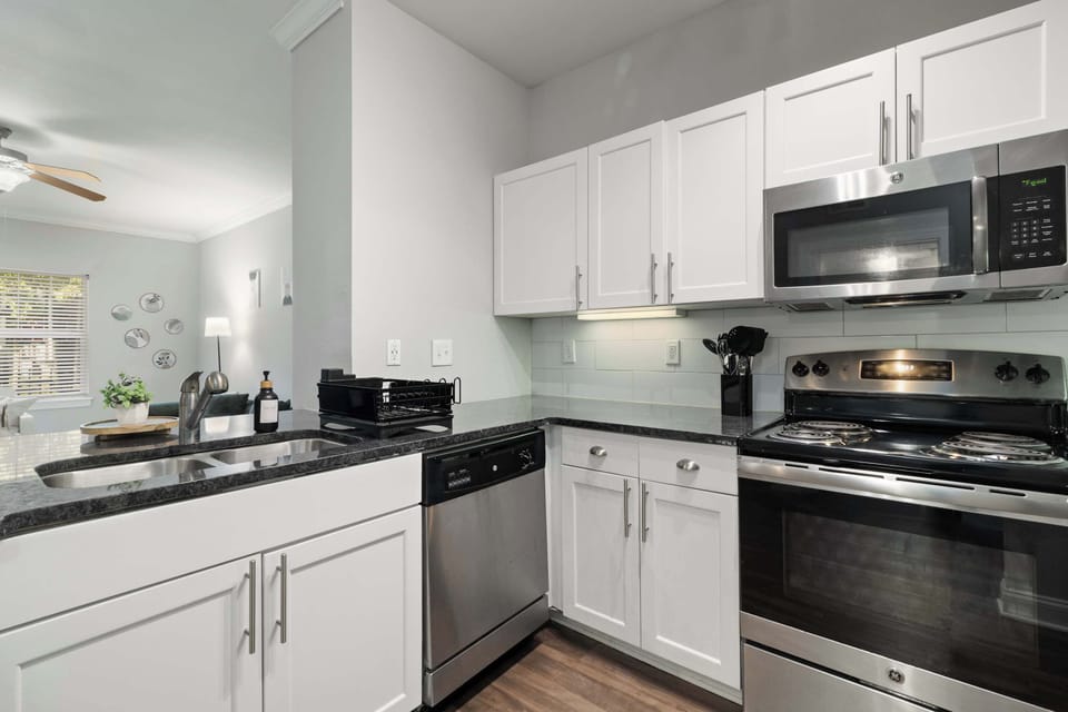 Gourmet kitchen with stainless steel appliances — ideal for long stays, cooking, and extended work trips