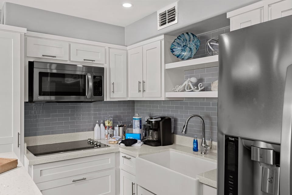 Bright, updated kitchen with modern finishes and everything you need for easy beachside meals.
