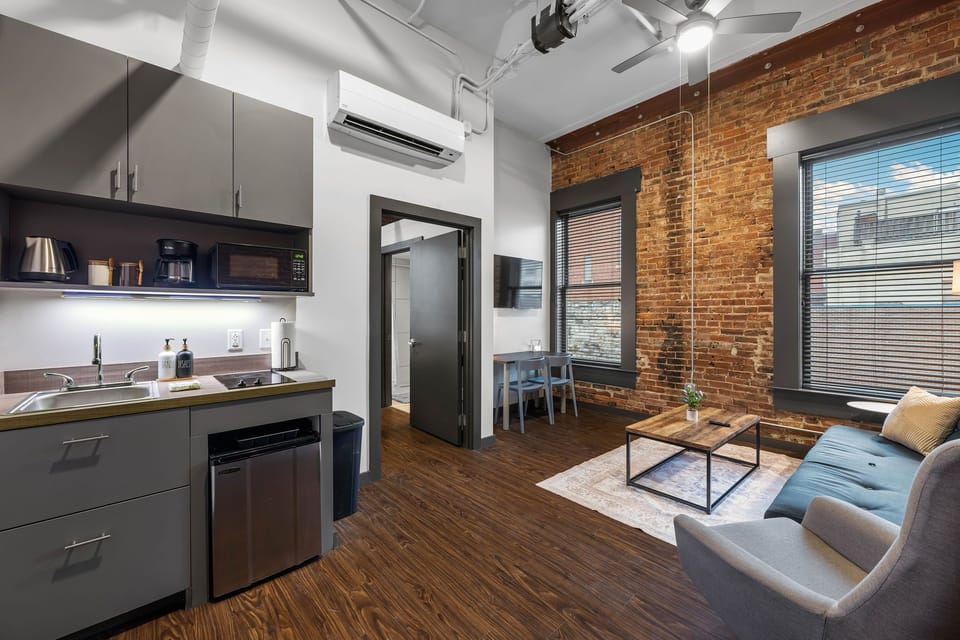 Open-concept space with modern furnishings and stylish entertainment.