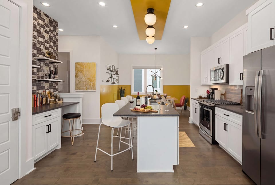 Step into your dream Nashville getaway at this stylish kitchen, perfect for gathering and creating unforgettable meals with friends. Experience modern elegance and comfort with Misfit Homes. Book now for your Nashville adventure!
