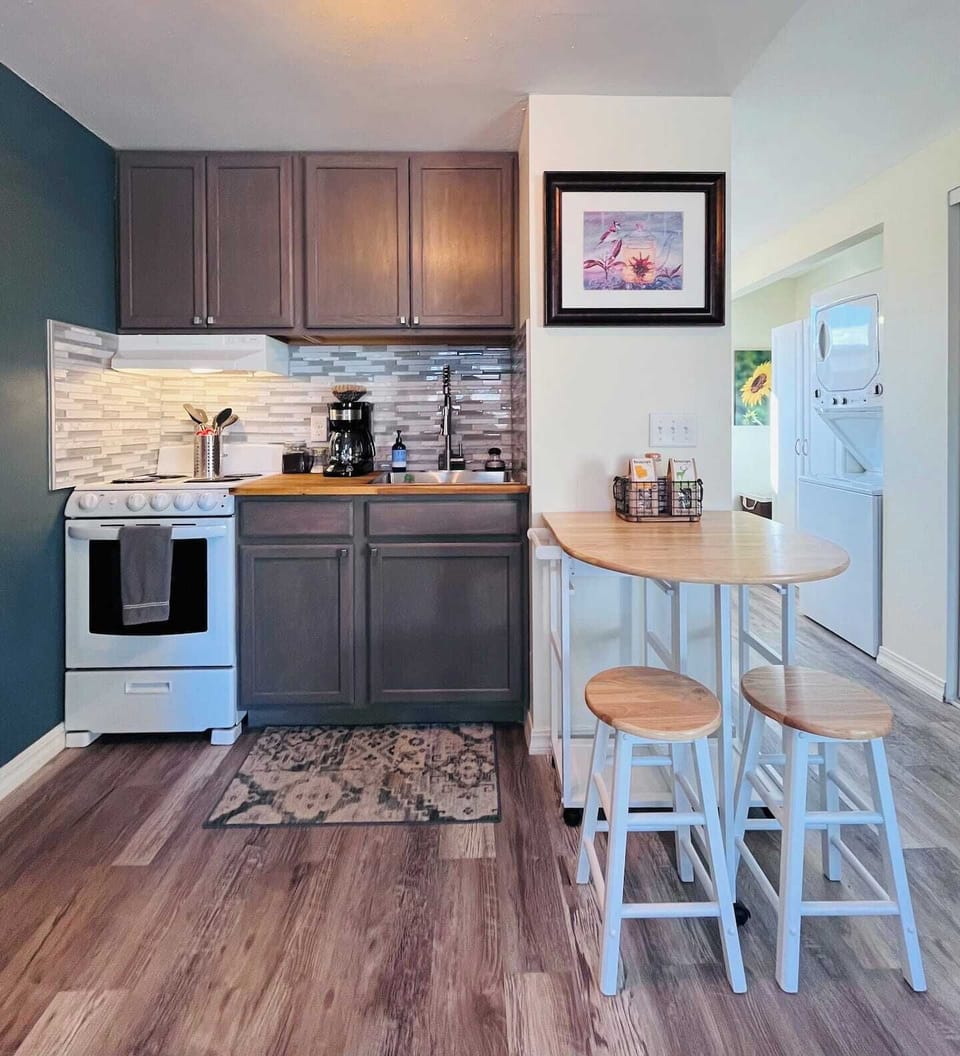 A compact but well-stocked kitchen and dining space.