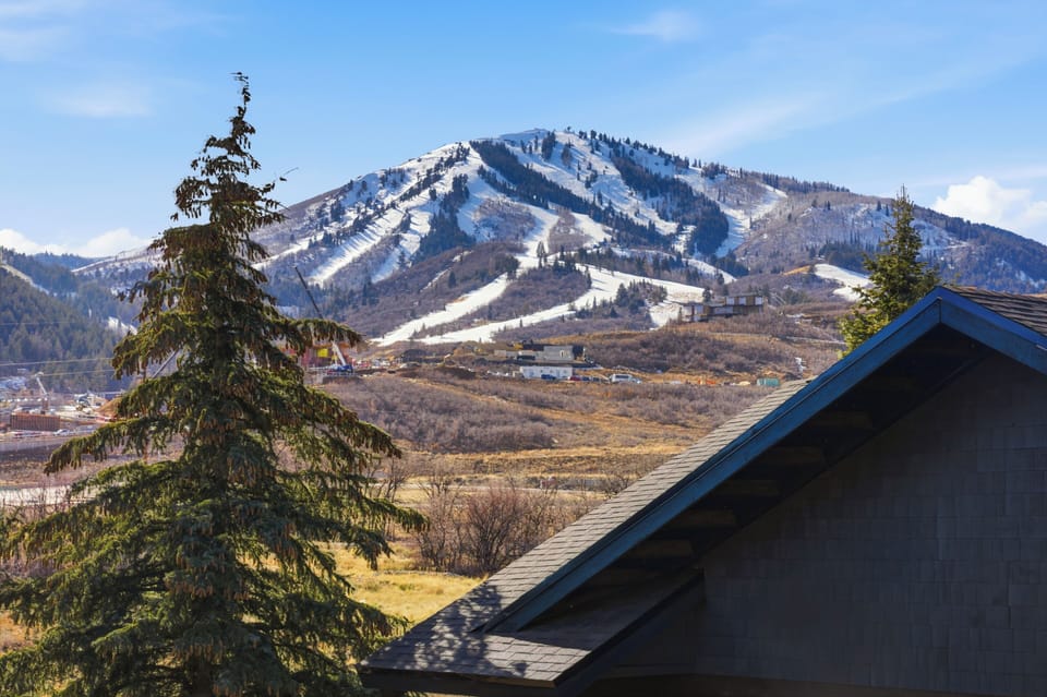 Expansive view of Deer Valley ski runs and mountain peaks from The Mason