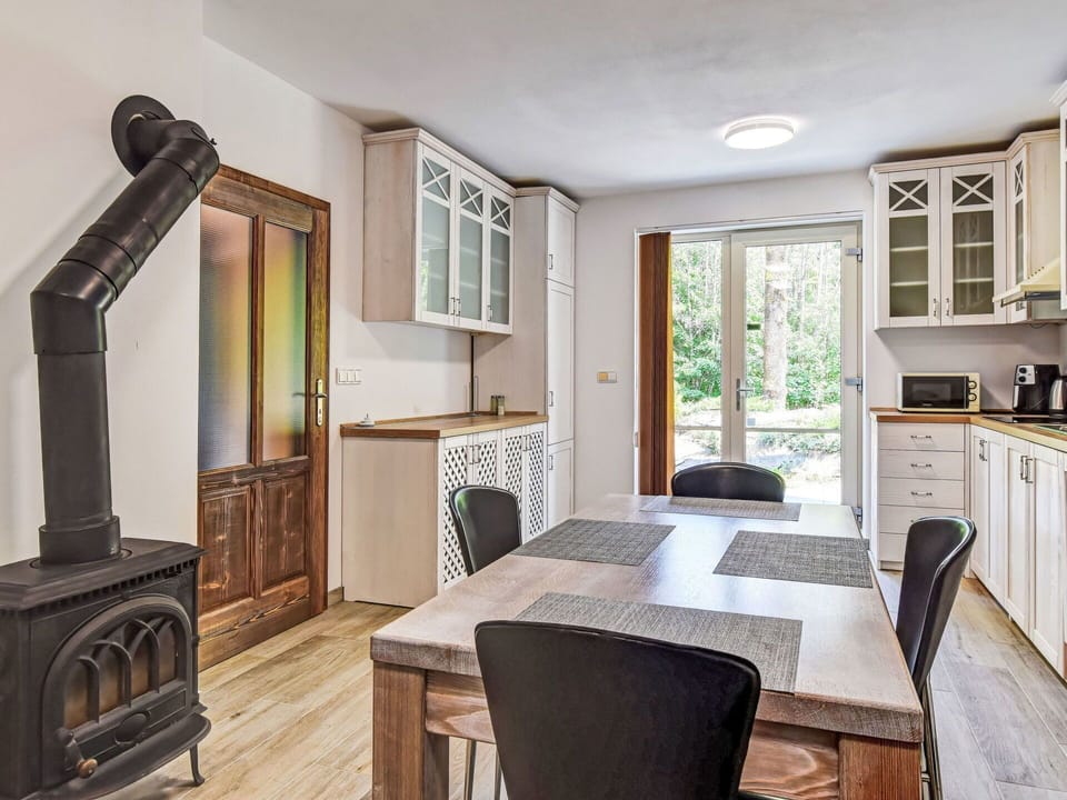 Furniture, Interior Design, Flooring, Wood, Ceiling, Floor, Room, Cabinetry, Chair, Lighting