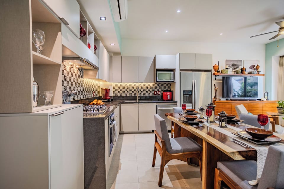 Your sleek modern kitchen awaits with premium appliances, stylish dining table, and everything needed for memorable meals together.