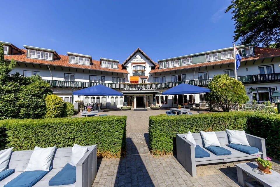 Unwind in the sunlit courtyard with lounge seating and views.