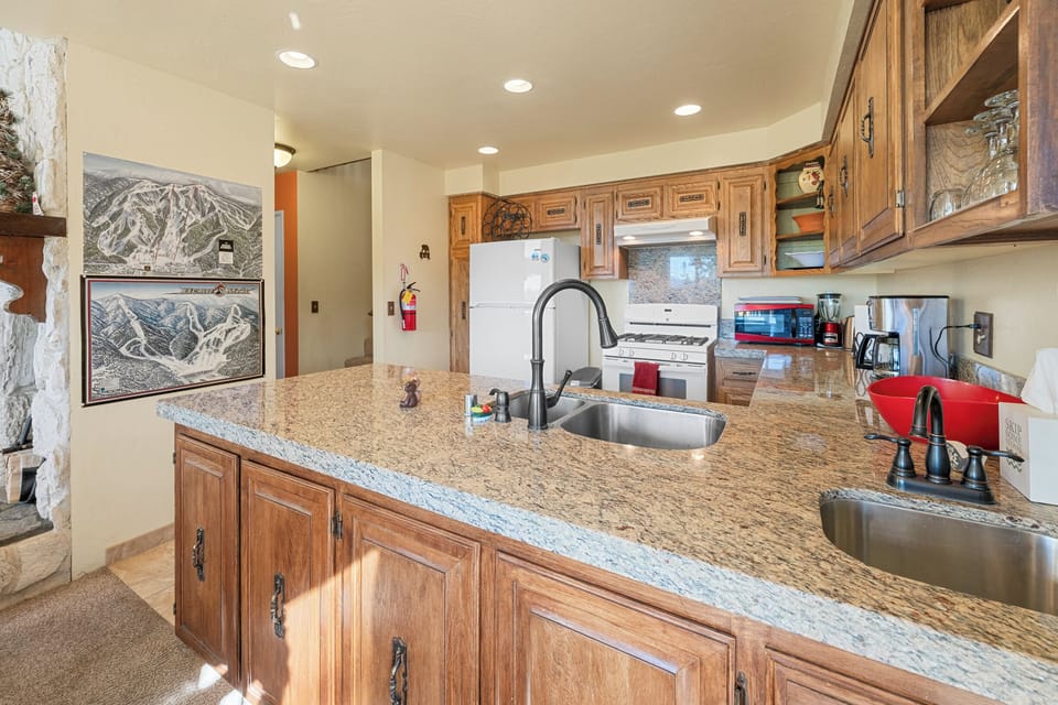 Full Kitchen - The fully stocked kitchen includes granite countertops, full-size appliances, cookware, and a coffee maker.