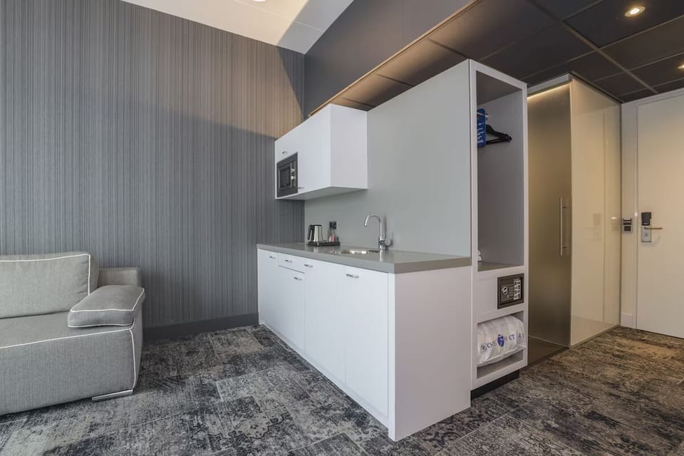 Enjoy simple in-room meals with a clean, modern kitchenette.