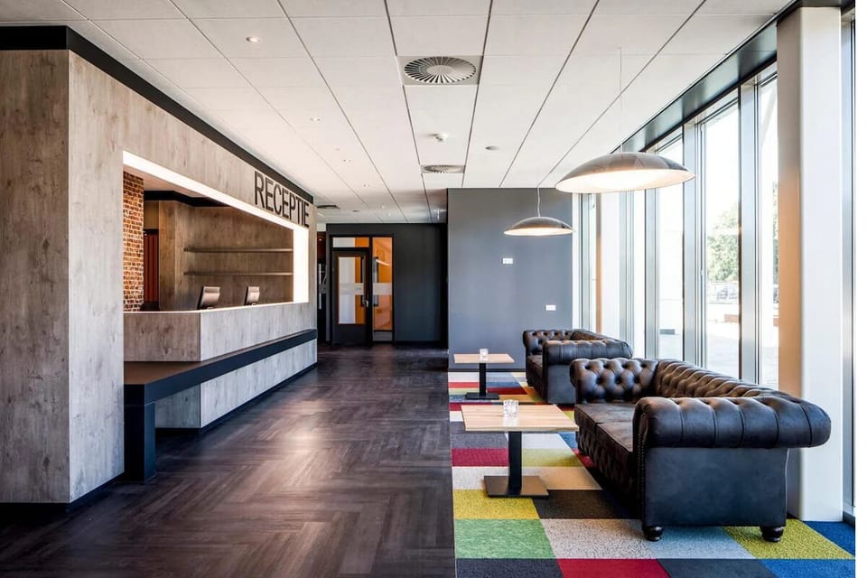 Step into a sleek lobby and settle in comfortably.