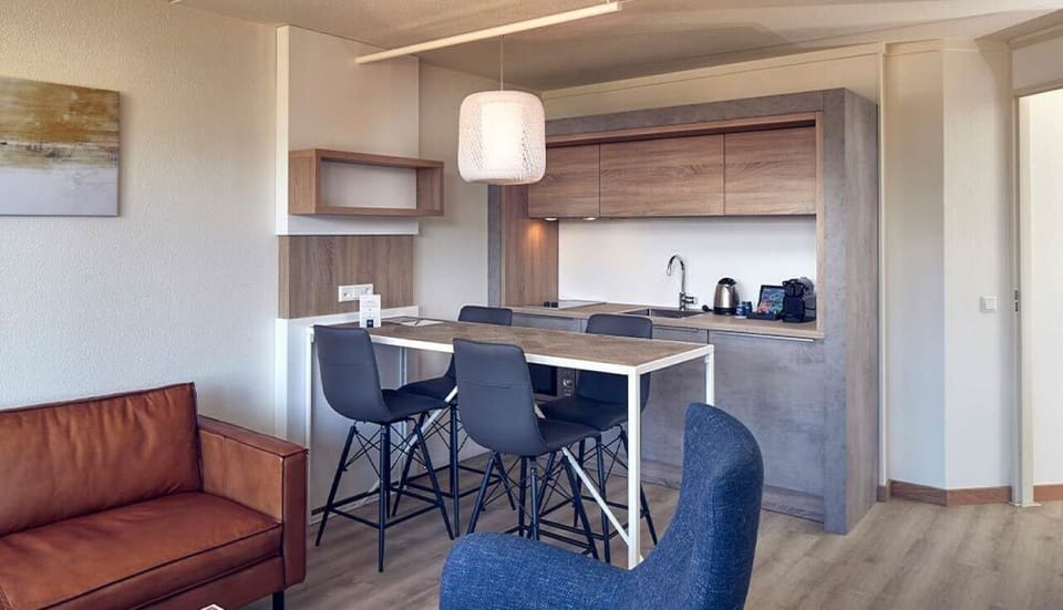 Gather for breakfast around the bar-height table and kitchenette.