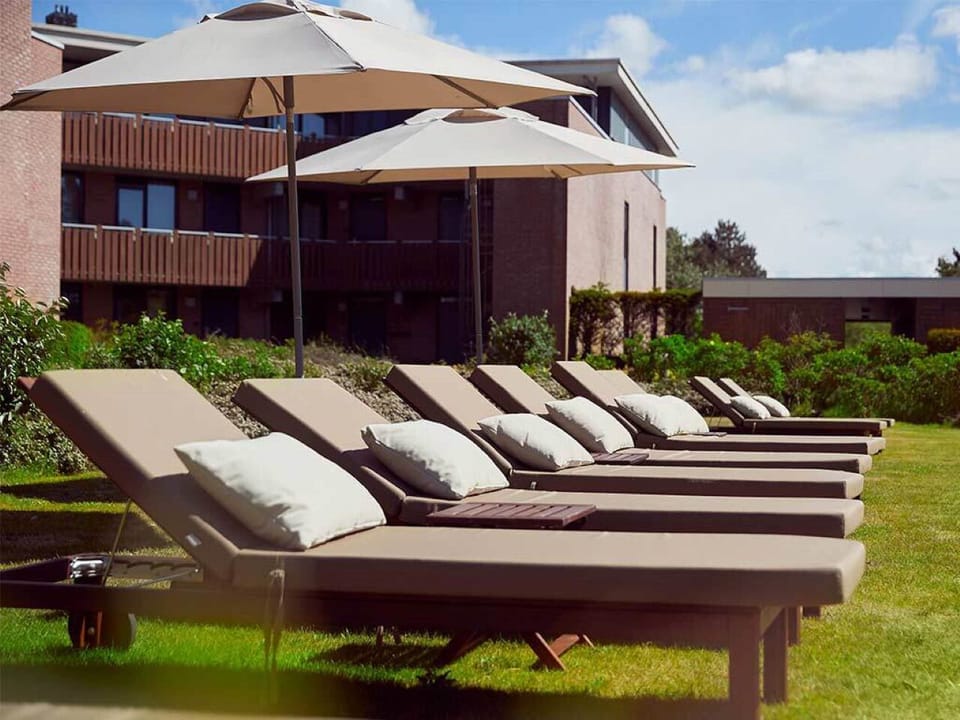 Soak up sunshine on plush loungers beneath wide, shady umbrellas.