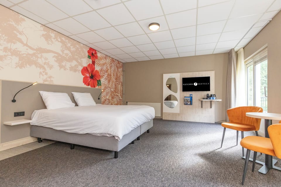 Unwind in crisp linens beneath bold floral feature wall.