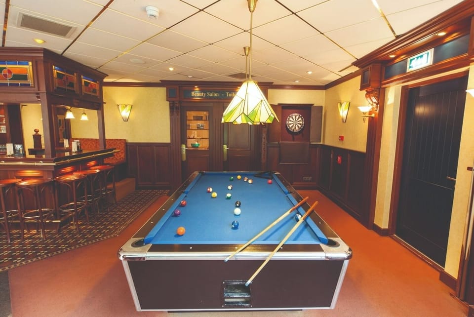 Challenge friends to a game of pool after dinner.