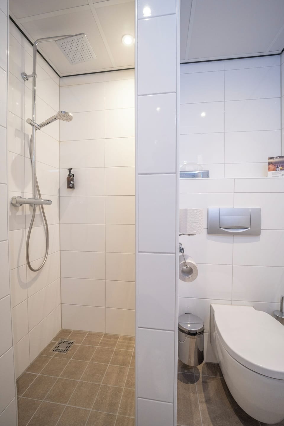 Rinse off quickly with a modern walk-in shower setup.