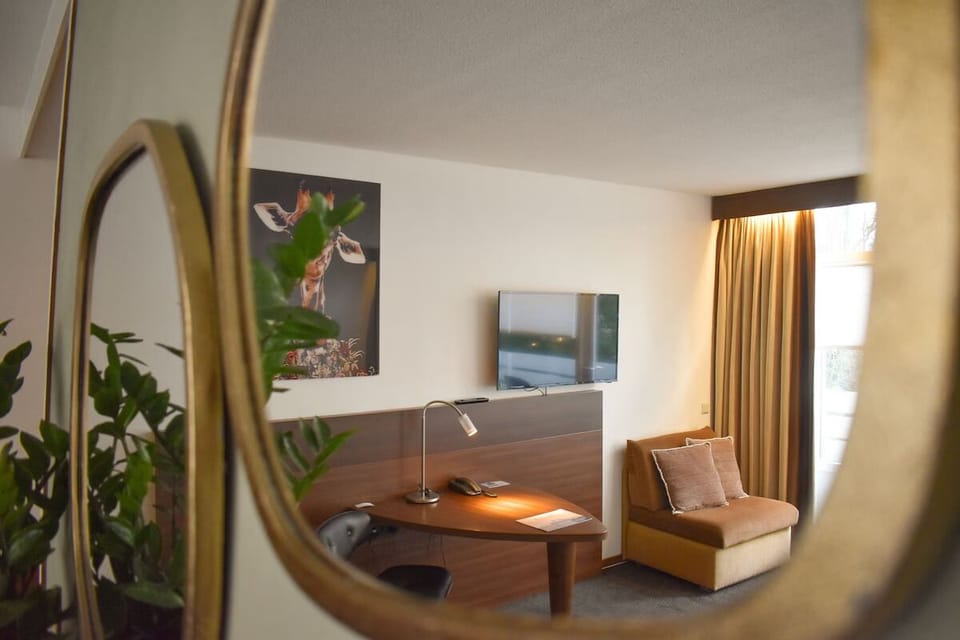 Settle in with a handy desk, TV, and daylight.