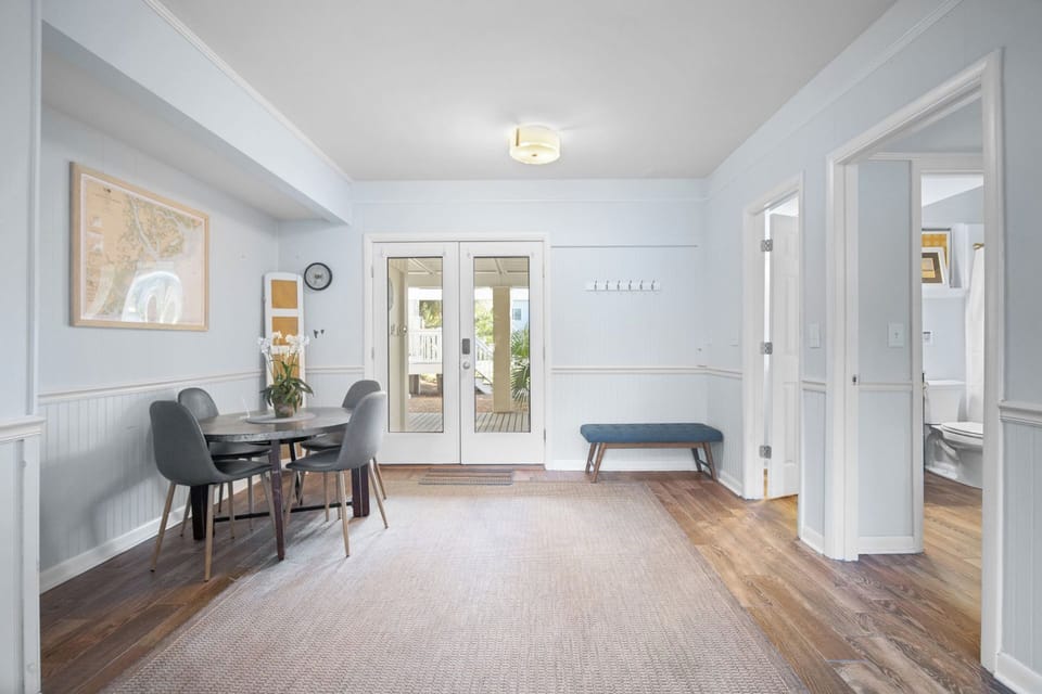1st Floor Entry with Seating and Dining Table