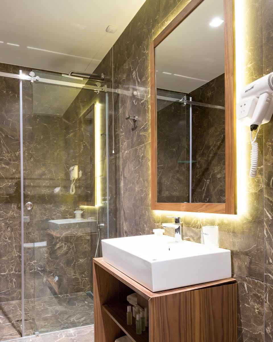 Economy Double Room | Bathroom | Shower, hair dryer, slippers, towels