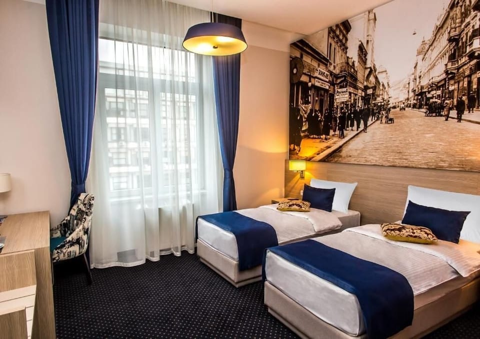 Deluxe Double or Twin Room, City View | In-room safe, laptop workspace, blackout drapes, iron/ironing board