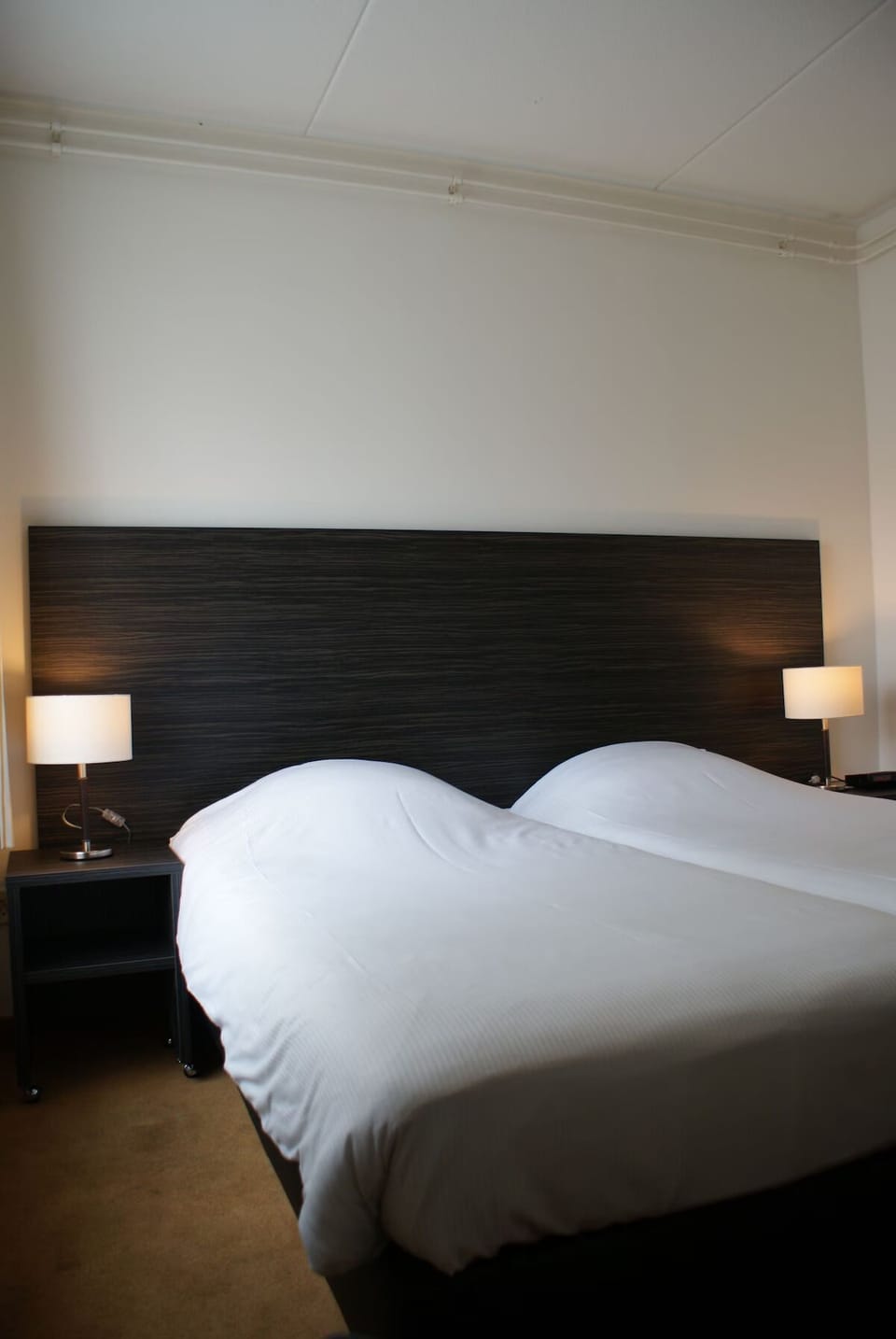 Settle into crisp linens for a quiet, restful night.