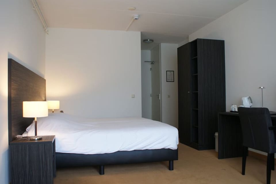 Settle into a calm, minimalist room with handy storage.