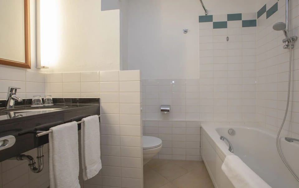 Start your morning smoothly with spotless vanity and deep tub.