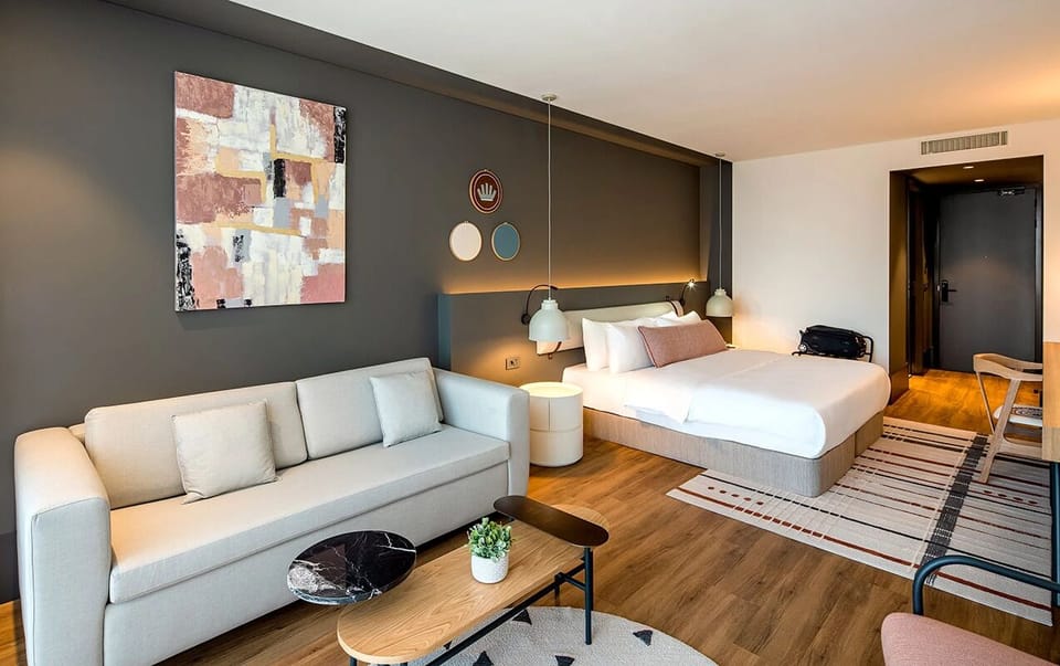 Lounge comfortably after exploring, with sofa seating and soothing tones.
