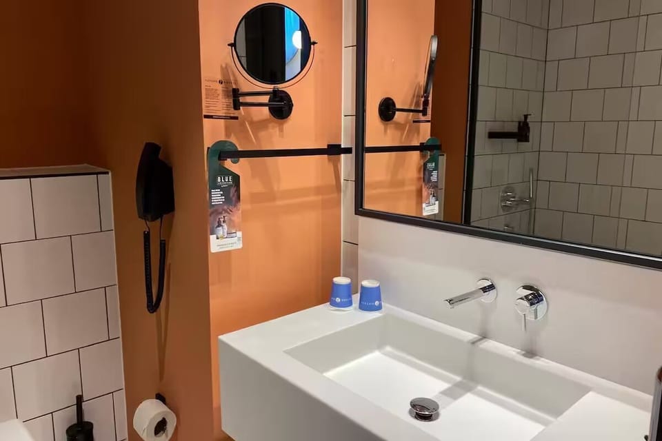 Freshen up easily with bright vanity space and sleek fixtures.