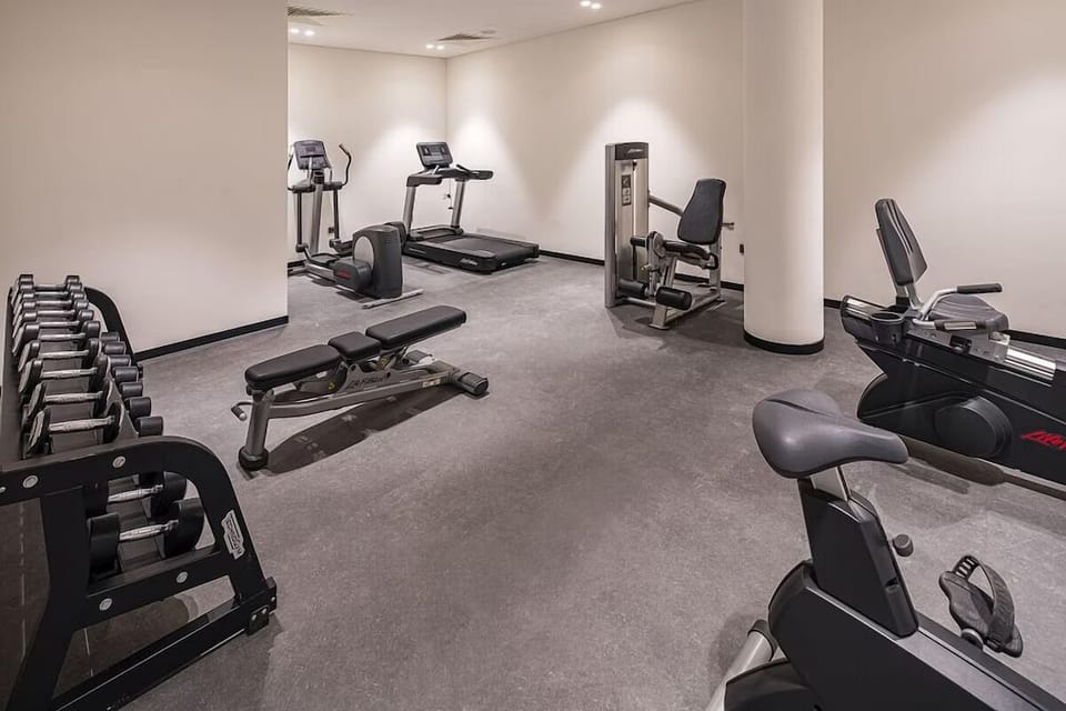 Keep your routine with cardio, weights, and plenty of space.