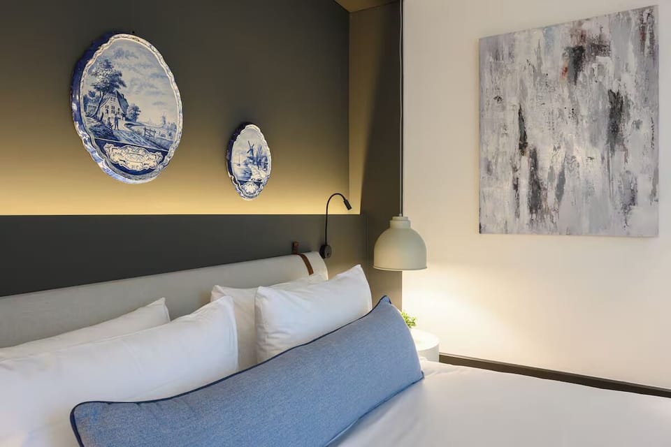Relax against plush pillows with artful accents and soft glow.