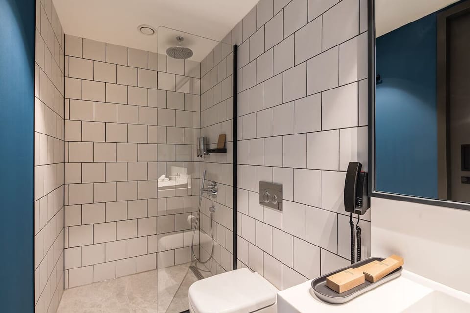 Rinse off in a spacious walk-in shower with rainfall comfort.