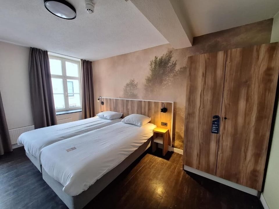 Settle into a warm, wood-accented room with soft lighting.