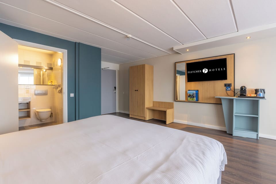 Unwind in a bright room with smart storage and desk.