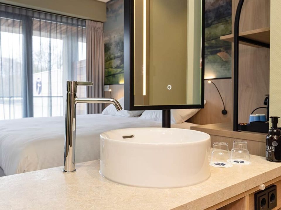 Start your day with a bright, designer basin and mirror.