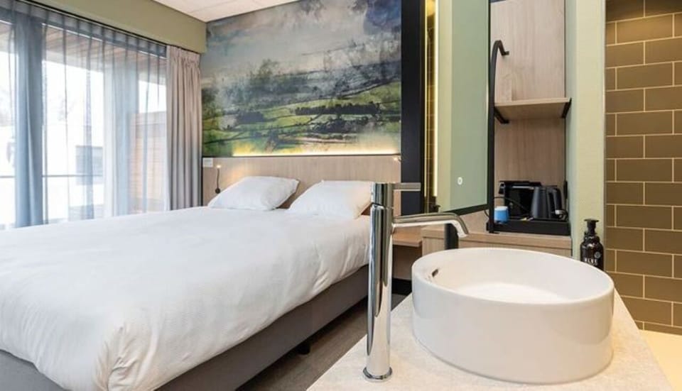 Enjoy airy mornings with soft daylight across the bed.